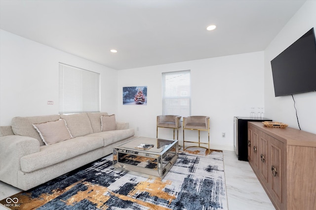 living room featuring marble finish floor and recessed lighting