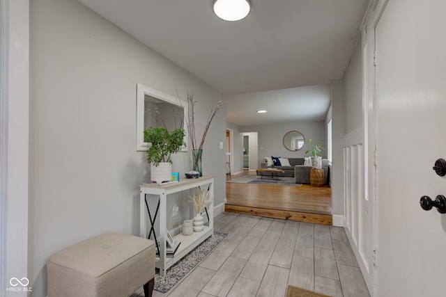 entrance foyer featuring wood finish floors and baseboards