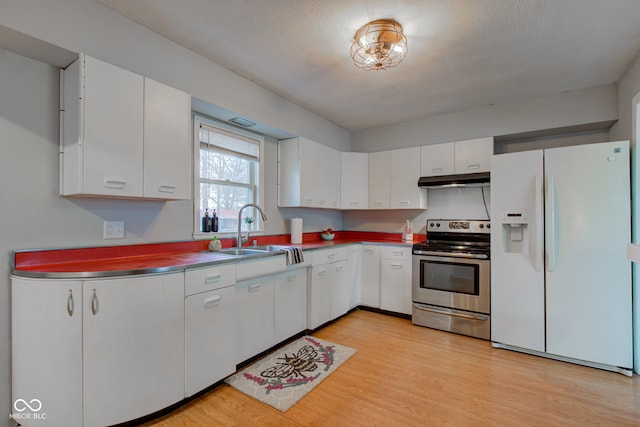 kitchen with electric range, white refrigerator with ice dispenser, white cabinets, light wood-type flooring, and a sink