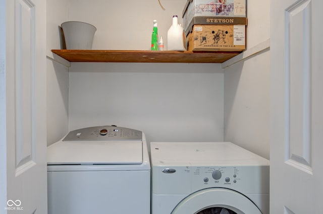 washroom featuring laundry area and washer and clothes dryer