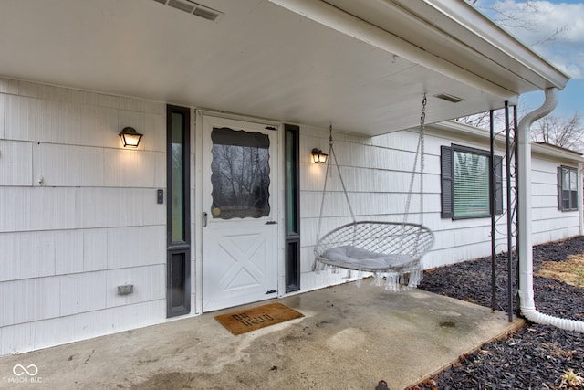 entrance to property featuring visible vents