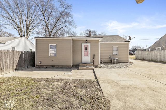 back of house featuring central AC unit, a patio, and fence