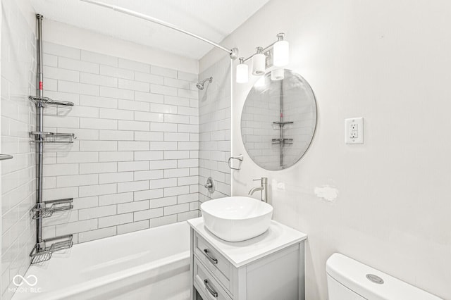 bathroom featuring shower / bath combination, toilet, and vanity