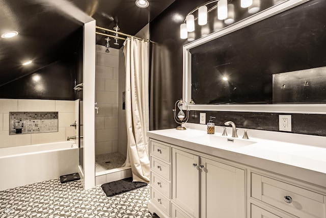 bathroom featuring recessed lighting, a stall shower, tile patterned flooring, and vanity