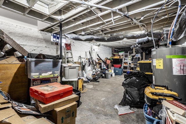 unfinished basement featuring water heater