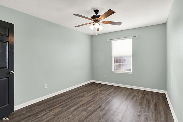 empty room with ceiling fan, baseboards, and dark wood-style flooring