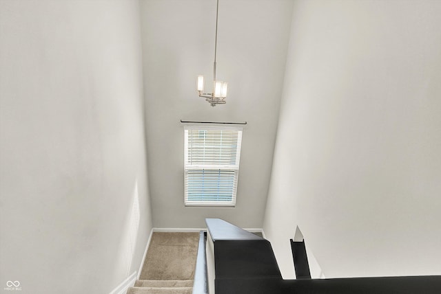 stairs featuring carpet floors and baseboards