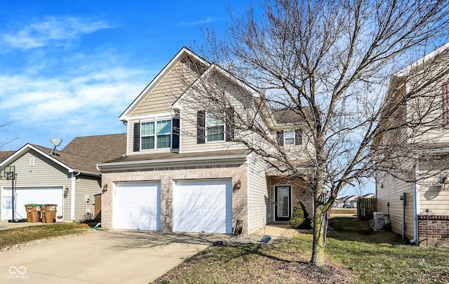 view of front of property with concrete driveway, brick siding, an attached garage, and a front yard