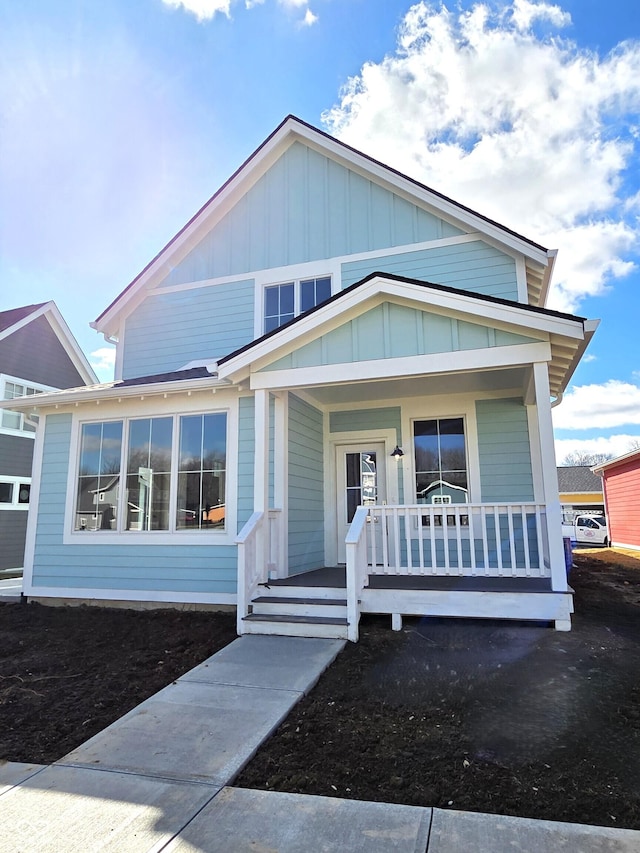 view of front of house with board and batten siding and a porch