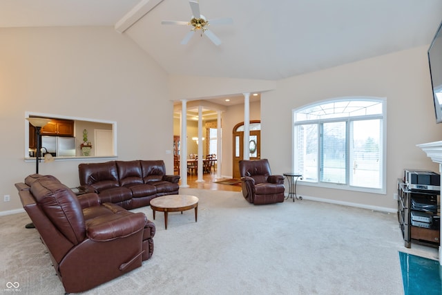 living area featuring carpet floors, high vaulted ceiling, beam ceiling, and ornate columns