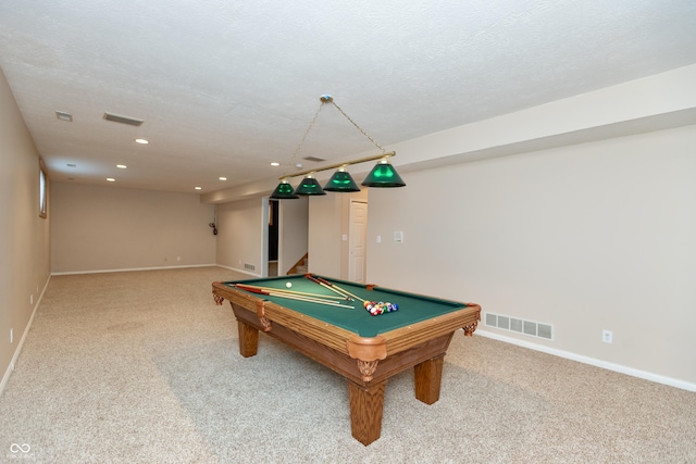 rec room with a textured ceiling, carpet, visible vents, and recessed lighting