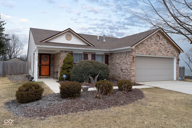 ranch-style house with an attached garage, brick siding, concrete driveway, and roof with shingles