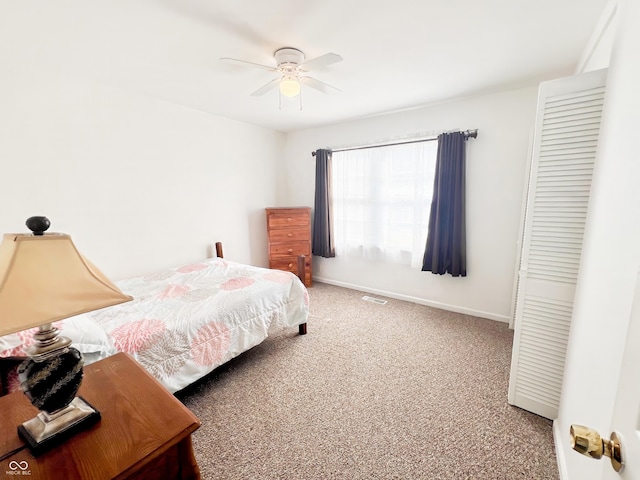 bedroom featuring a ceiling fan, baseboards, visible vents, and carpet flooring