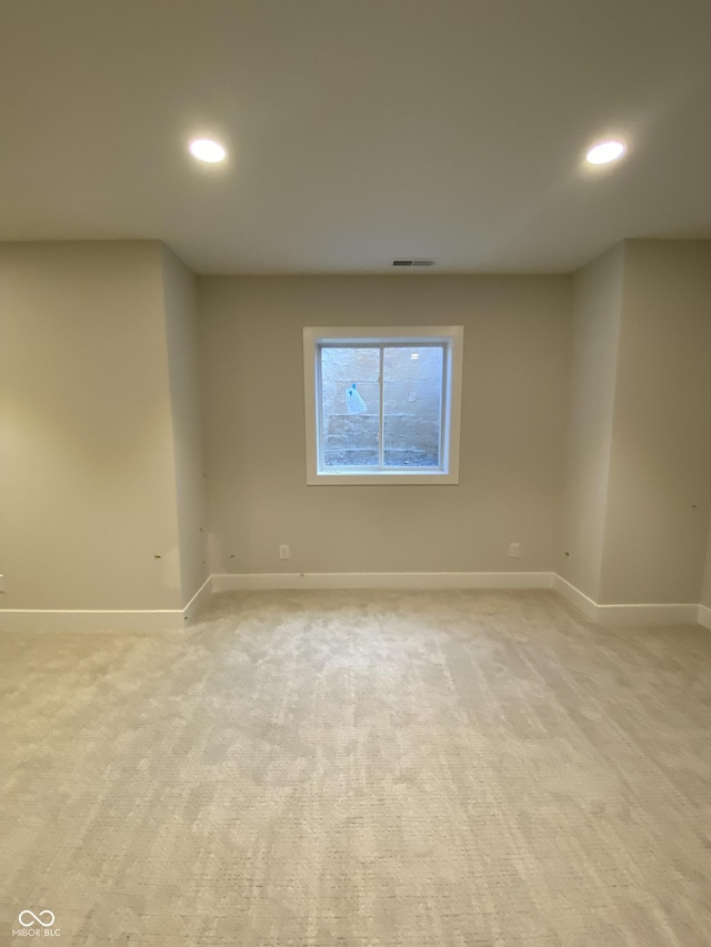 unfurnished room with recessed lighting, visible vents, and light colored carpet