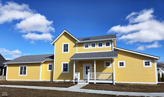 view of front of home featuring covered porch and roof with shingles