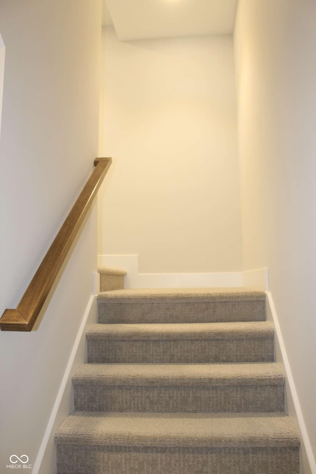 stairs featuring baseboards