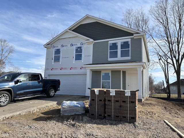 view of front of property featuring covered porch, driveway, and an attached garage