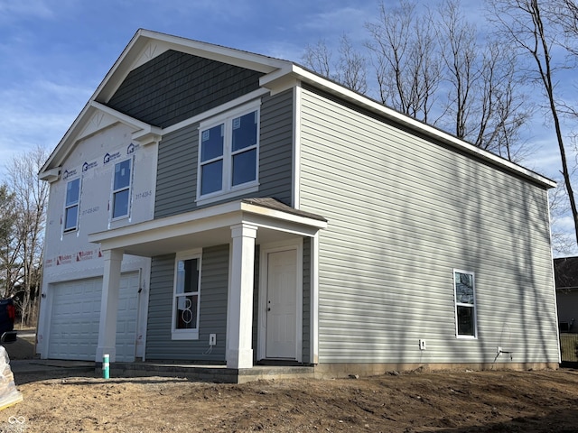 view of property exterior featuring an attached garage