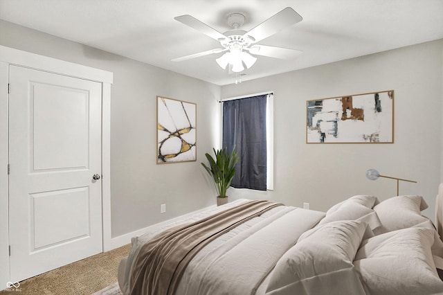 bedroom featuring baseboards, a ceiling fan, and carpet flooring