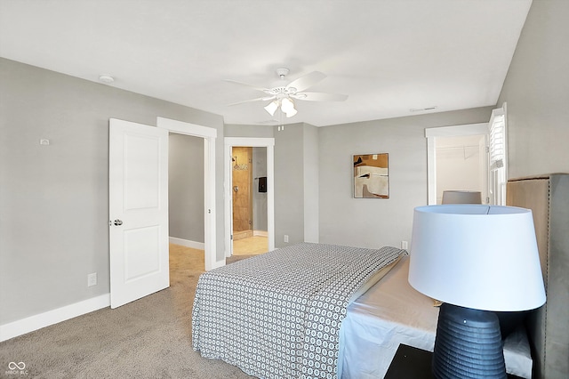 bedroom featuring visible vents, baseboards, light colored carpet, and a ceiling fan