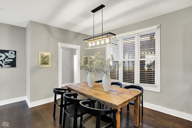 dining room with dark wood-style floors and baseboards