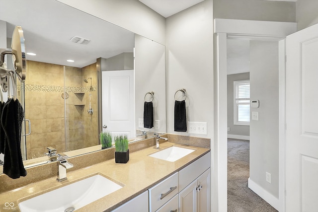 full bathroom featuring a sink, visible vents, baseboards, and a stall shower