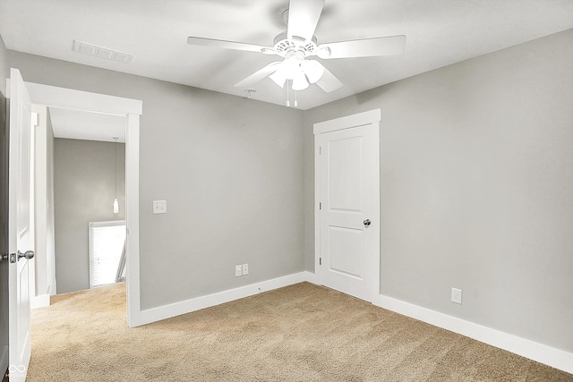 unfurnished bedroom with visible vents, ceiling fan, baseboards, and carpet floors