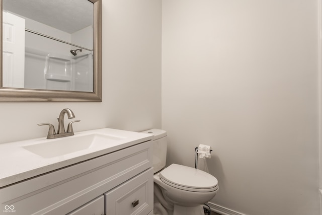 full bath with a shower, vanity, and toilet