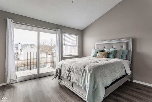 bedroom featuring access to outside, lofted ceiling, baseboards, and wood finished floors