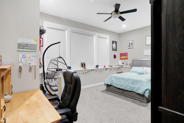 carpeted bedroom with a ceiling fan