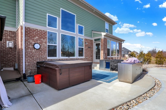 view of patio / terrace featuring a hot tub