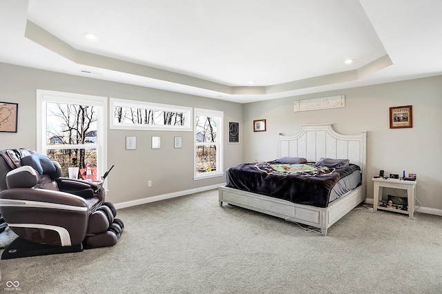 bedroom featuring carpet floors, a tray ceiling, baseboards, and recessed lighting