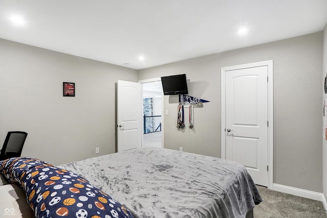 bedroom featuring recessed lighting, carpet, and baseboards