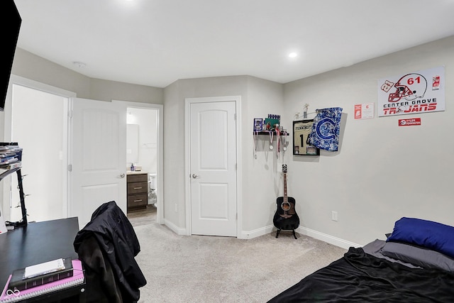 bedroom with light carpet, baseboards, connected bathroom, and recessed lighting