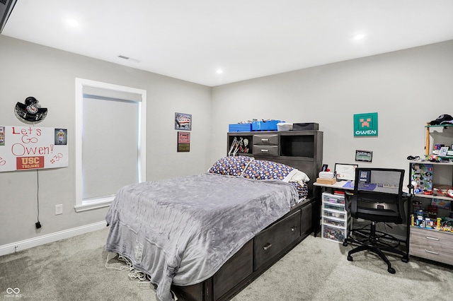 carpeted bedroom with baseboards and visible vents