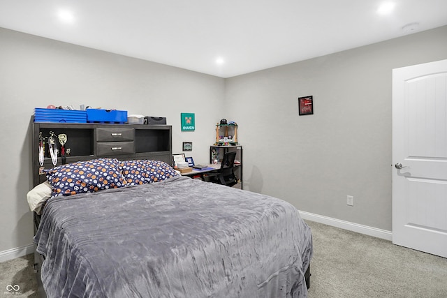 bedroom with carpet floors and baseboards