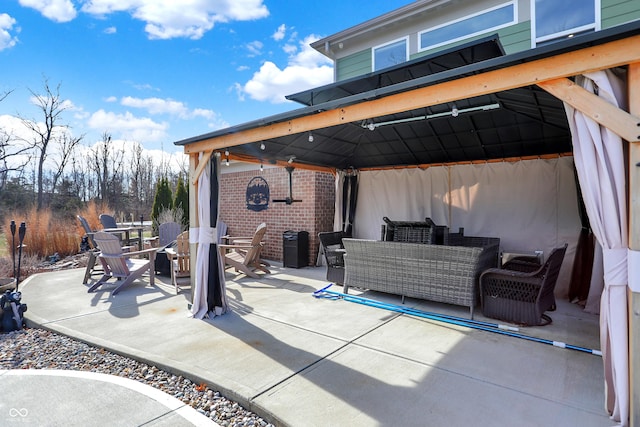 view of patio / terrace with outdoor dining area and a gazebo