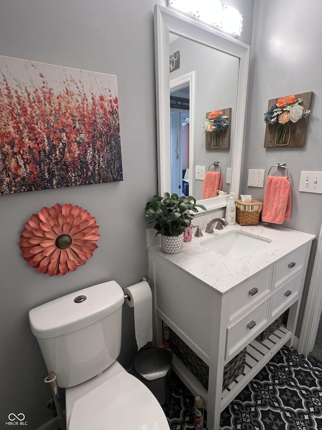 bathroom featuring vanity and toilet