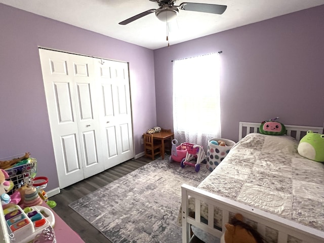 bedroom featuring ceiling fan, a closet, baseboards, and wood finished floors