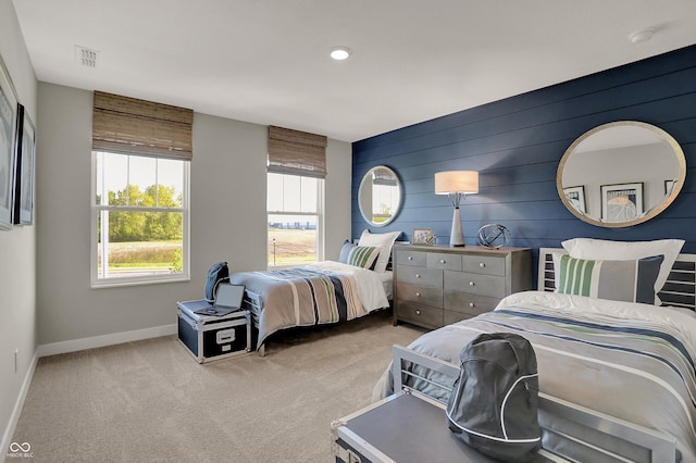 bedroom featuring carpet, visible vents, and baseboards