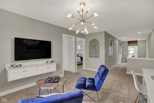 living area featuring baseboards, light colored carpet, and a notable chandelier