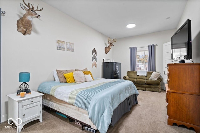 bedroom with light colored carpet