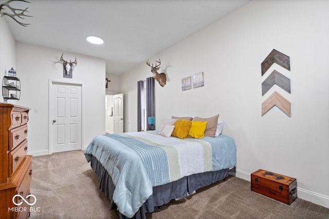 carpeted bedroom with baseboards