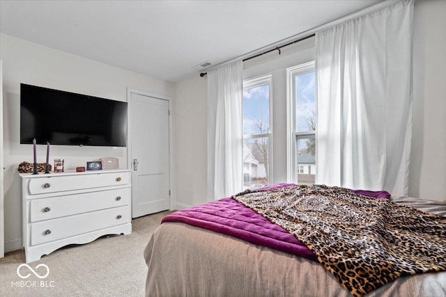 bedroom featuring carpet and visible vents