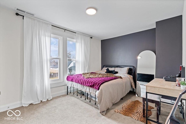 bedroom featuring carpet floors, baseboards, and visible vents