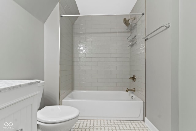 bathroom with tile patterned flooring, toilet, vanity, baseboards, and shower / washtub combination