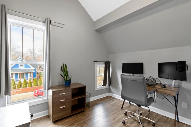 office with lofted ceiling, baseboards, and wood finished floors