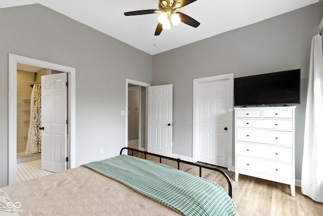 unfurnished bedroom with a ceiling fan, baseboards, light wood finished floors, and ensuite bathroom