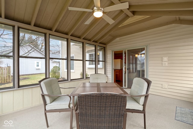 sunroom / solarium with lofted ceiling with beams and ceiling fan