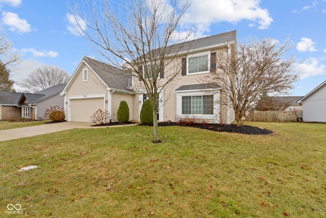 traditional-style house with a garage, a front yard, driveway, and fence